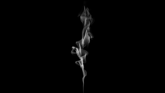 Twisting abstract cigarette white smoke on a black background