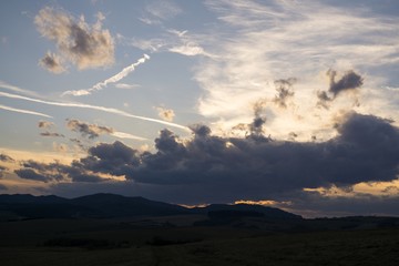Sunset and sunrise with dramatic colorful clouds. Slovakia