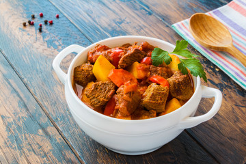 Traditional Hungarian dish, goulash, slow-cooked with beef, potatoes, carrot, tomatoes, paprika,...