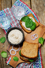 White bean hummus spinach rye sandwich