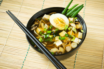Miso soup in black bowl, closeup