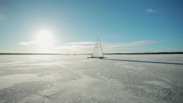 Iceboat monotype XV on a ice frozen lake at sunny day