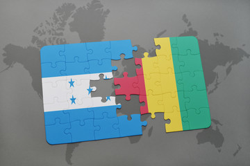 puzzle with the national flag of honduras and guinea on a world map