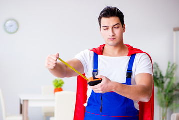 Superhero repairman with tools in repair concept