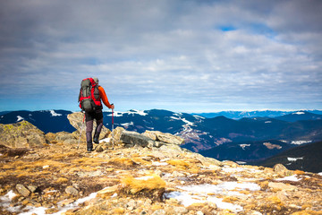 The man climbed to the top of the mountain.