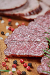 Set of cold cuts on a wooden board. Mix of sausages