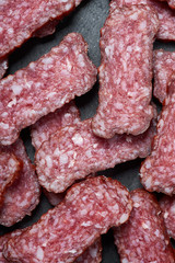 Sliced salami on a stone board