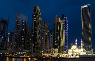 Fototapeta na wymiar Skyscrapers in Dubai Marina at night . United Arab Emirates