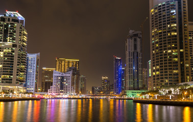 Fototapeta na wymiar Skyscrapers in Dubai Marina at night. United Arab Emirates