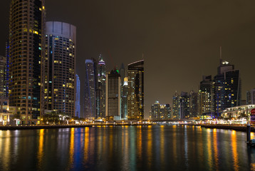 Obraz na płótnie Canvas Skyscrapers in Dubai Marina at night. United Arab Emirates