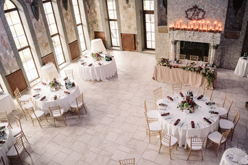 Interior of a wedding decorated restaurant ready for guests, view from the top