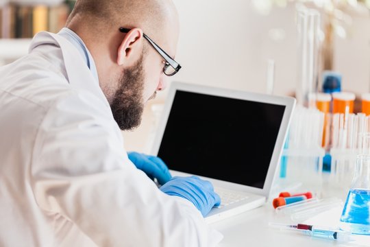 Man researcher carrying out scientific research.