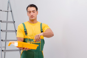 Man painting the wall in DIY concept