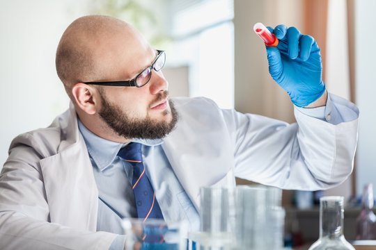 Man researcher carrying out scientific research.