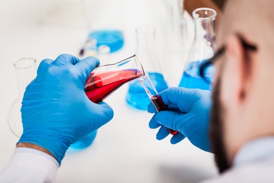 Man researcher carrying out scientific research.