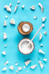 Obraz na płótnie Canvas concept organic cosmetics with coconut on blue background top view
