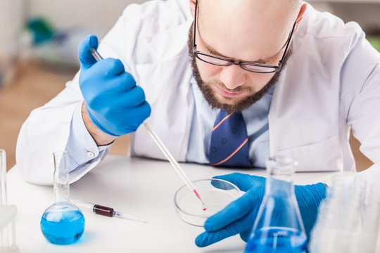 Man researcher carrying out scientific research.