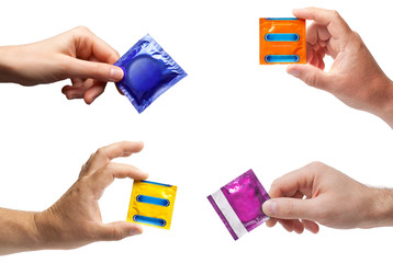 Condom in female and male hand isolated on white background