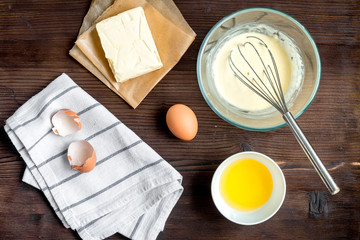 cooking pancake on wooden background top view ingredients for making