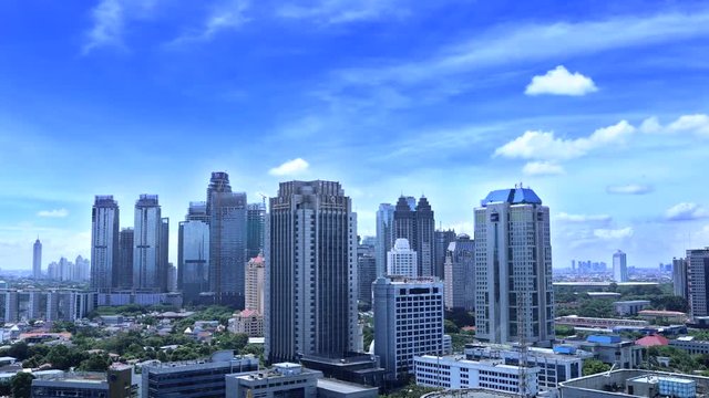 Timelapse of modern office buildings with clear sky in Central Jakarta, Indonesia