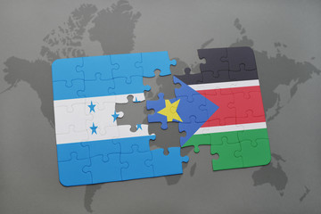 puzzle with the national flag of honduras and south sudan on a world map