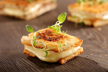 Fresh toast with cheese and herbs