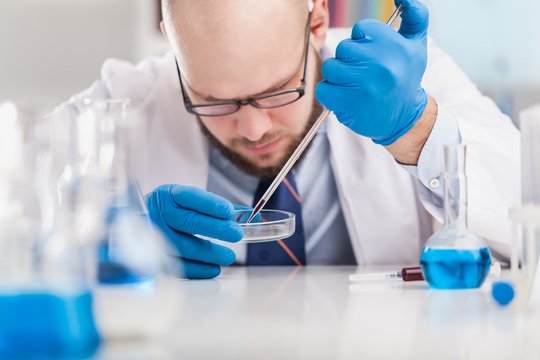 Man researcher carrying out scientific research.