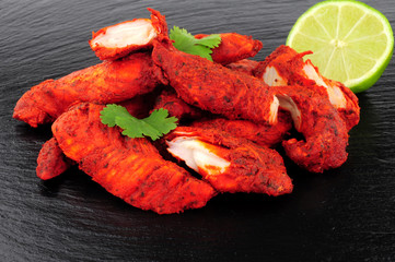 Tandoori Chicken On A Slate Background © philip kinsey