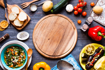 Fresh vegetable soup made at home, on wooden rustic table,  top view