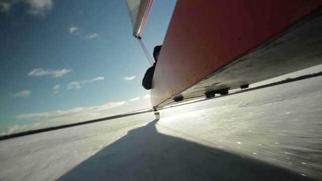The rear skate of the iceboat riding on the ice