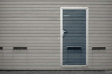 Garage gate with ventilation grilles. Large automatic up and over garage door with inclusion of smaller personal door. Multicolor background set