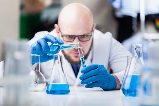 Man researcher carrying out scientific research.