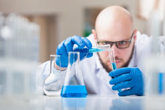 Man researcher carrying out scientific research.