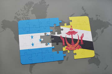 puzzle with the national flag of honduras and brunei on a world map