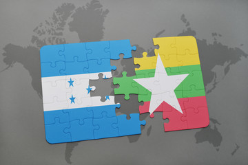 puzzle with the national flag of honduras and myanmar on a world map