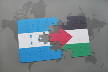 puzzle with the national flag of honduras and palestine on a world map