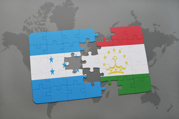 puzzle with the national flag of honduras and tajikistan on a world map