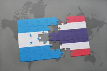 puzzle with the national flag of honduras and thailand on a world map