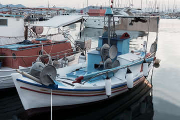 greek traditional small blue boat in the port