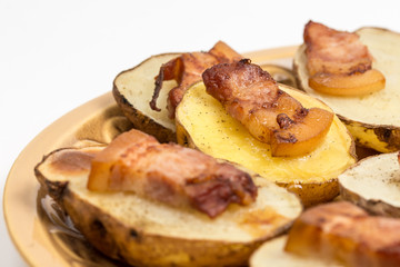Baked potatoes with skin and bacon on it