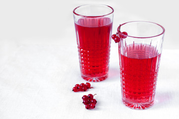 Drink red currant in a beautiful transparent glass