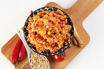 Delicious vegetarian quinoa salad with bell pepper, cucumber and tomatoes