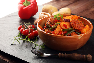 Roast meatballs, chips or roasted potatoes and vegetables