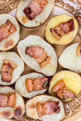 Flat lay baked potatoes with skin and fried bacon