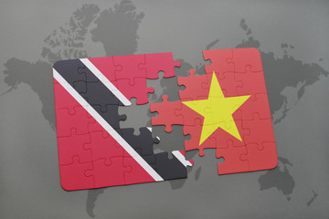 puzzle with the national flag of trinidad and tobago and vietnam on a world map