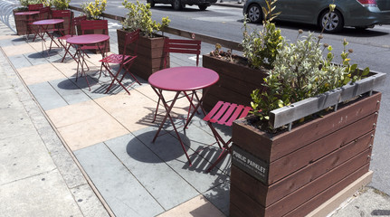 Cute and relaxing San Francisco city sidewalk parklet eliminates precious street parking spaces.