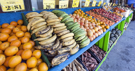 Sidewalk fruit and vegetable stand.