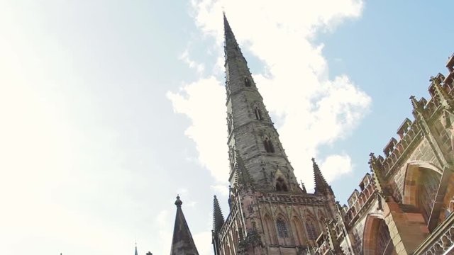 Lichfield Cathedral stands grand and Gothic against the blue sky