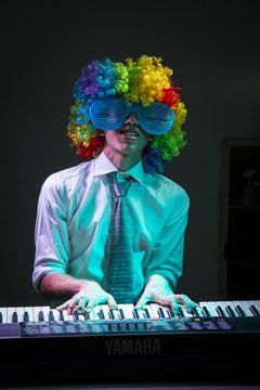 man with glasses and wig