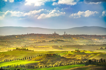 Siena city skyline, countryside and rolling hills. Tuscany, Italy - obrazy, fototapety, plakaty